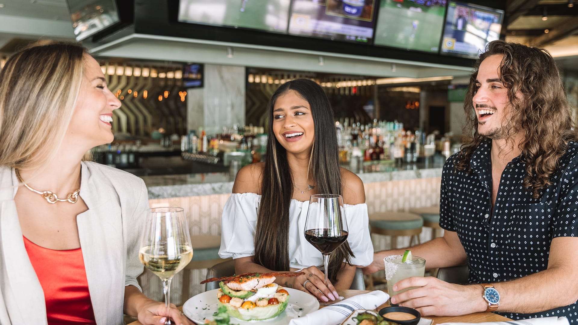 girls having fun eating at moxies